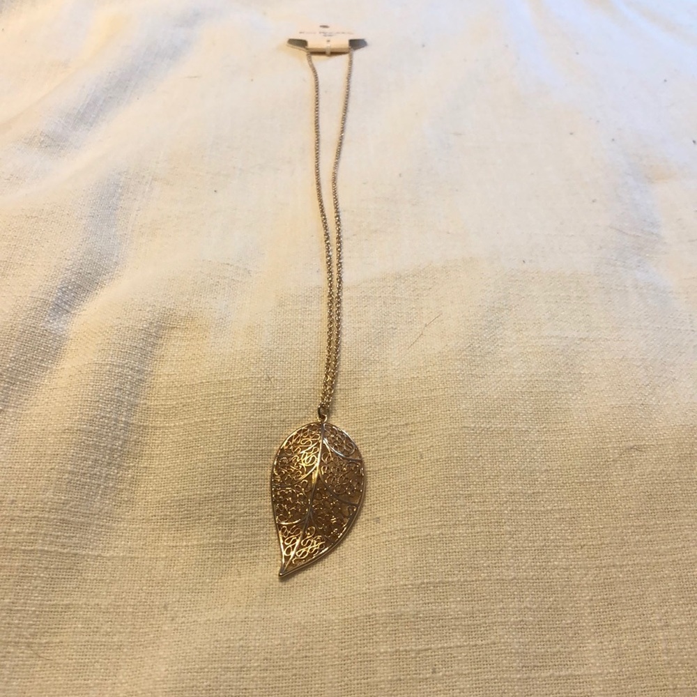 Gold colored long necklace
